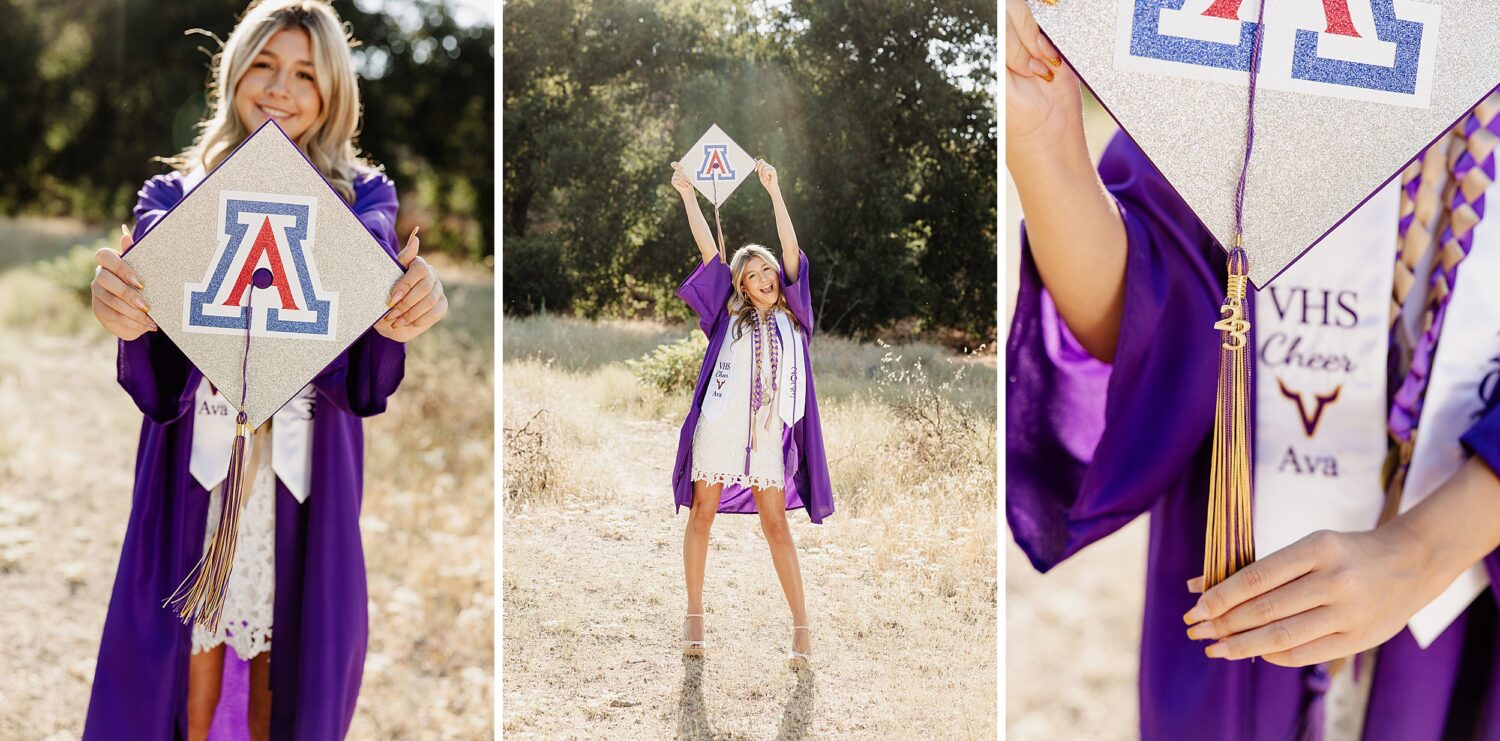 Senior girl wearing a purple cap and gown, standing in a sunlit field 