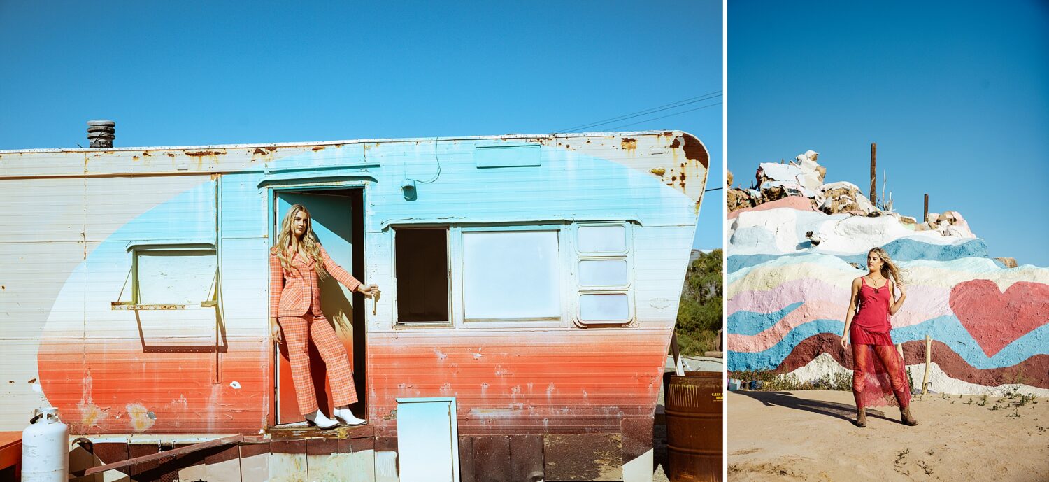 Creative senior portrait photography workshop in Southern California featuring teen model posing beside a pastel vintage trailer in the desert