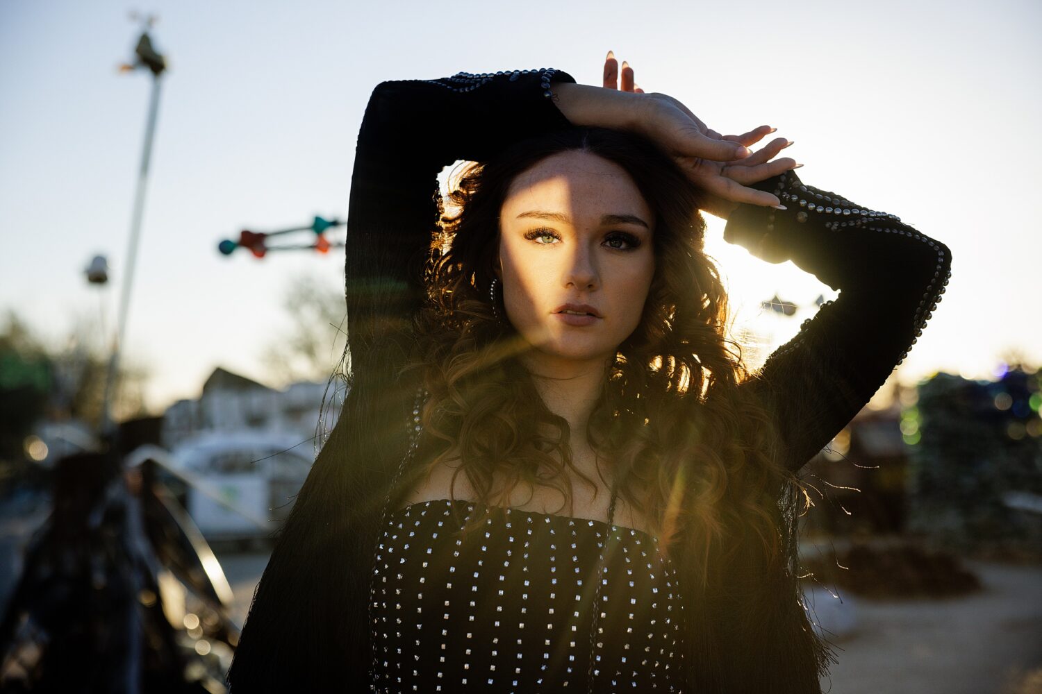 Desert golden hour senior portrait session highlighting a warm, cinematic aesthetic in Palm Springs.
