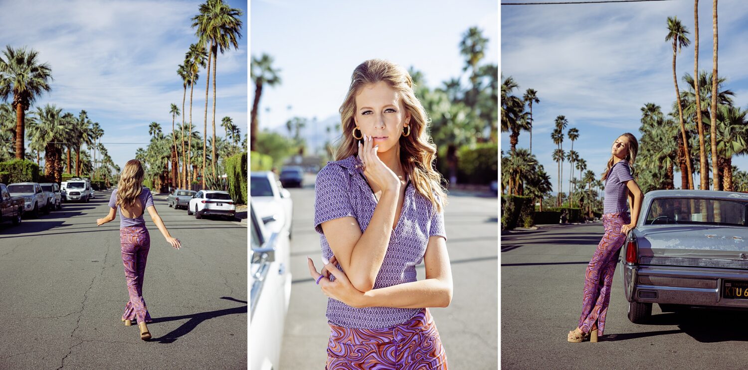 Palm Springs senior portrait inspiration with blonde model posing on a palm tree-lined street beside a vintage classic car in retro fashion styling