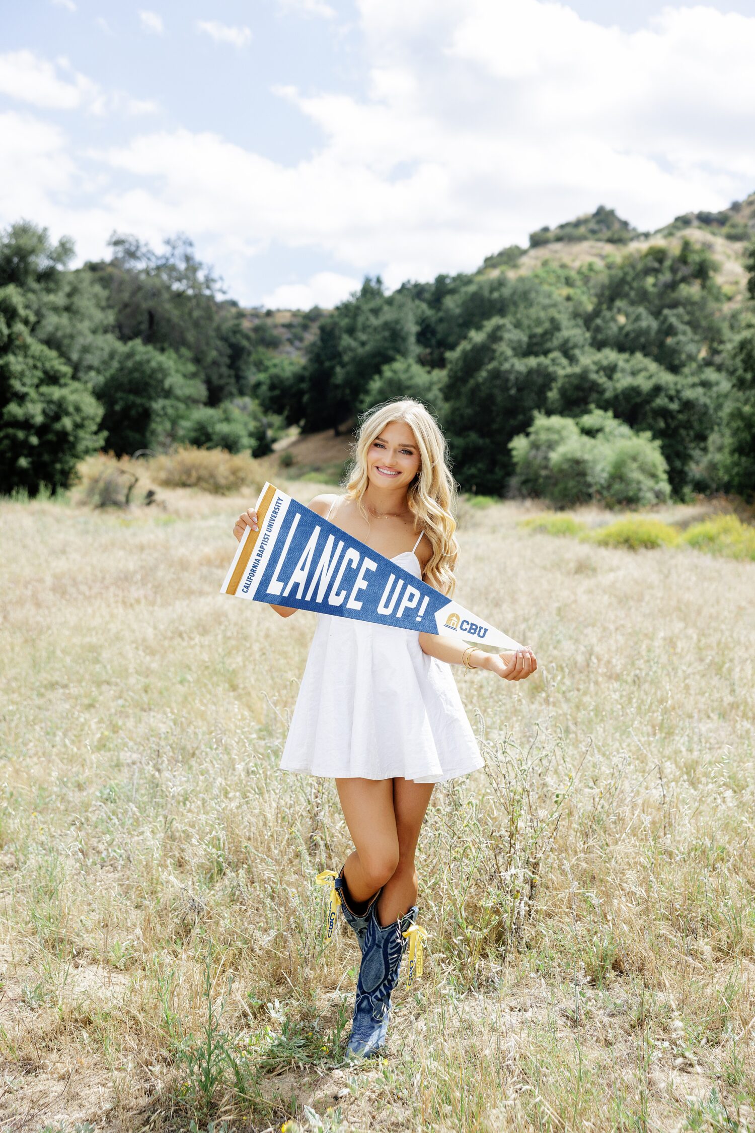 senior girl CBU pennant smiling golden field Los Angeles photographer